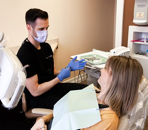 Marysville dentist speaking with patient in exam chair