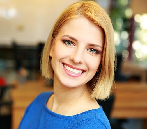 woman with short hair smiling