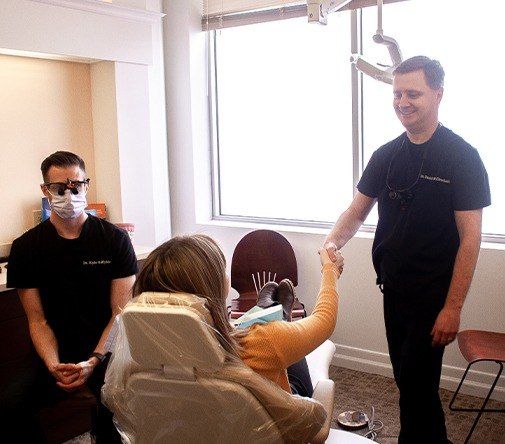 Marysville dentist shaking patients hand