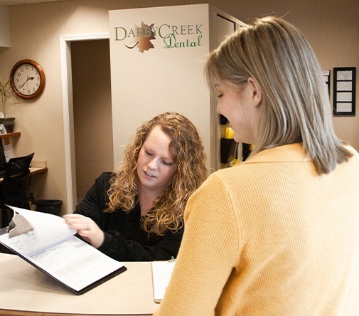 team member showing patient payment options