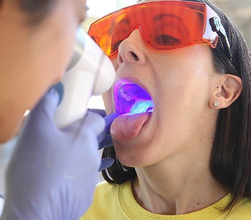 woman getting oral cancer screening