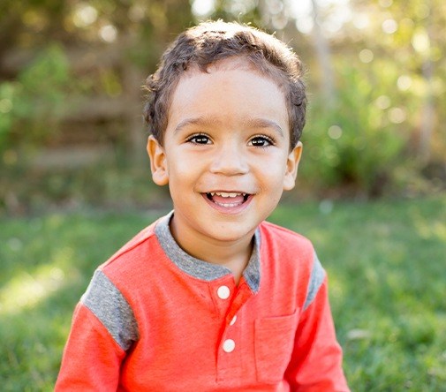 toddler outside smiling