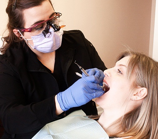 woman getting dental cleaning in Marysville