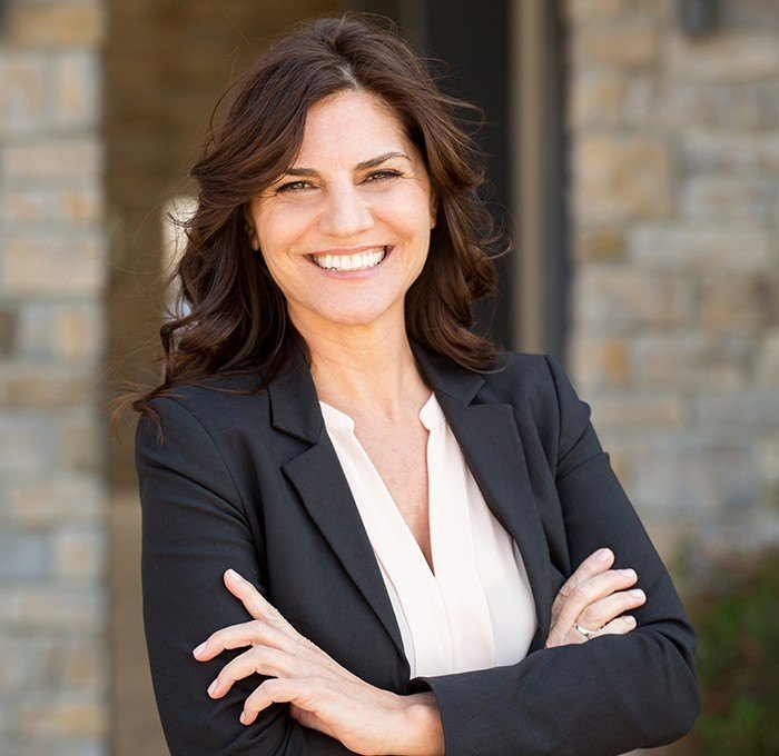 woman in dress suit smiling