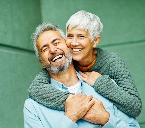 Smiling, happy senior couple