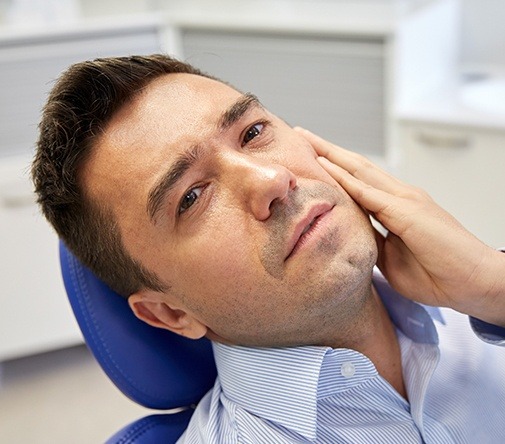 man with dental pain