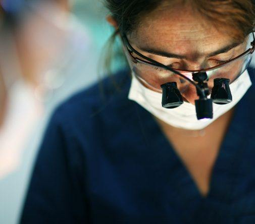 dentist with microscope lenses on