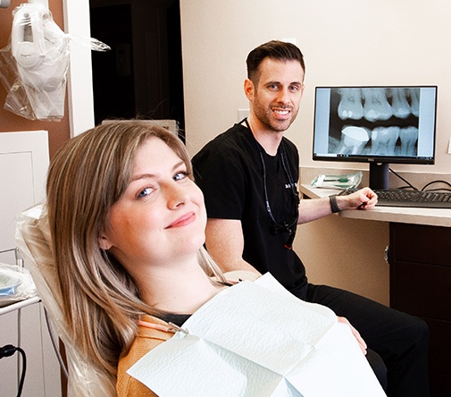 Dr. Wylde with patient and her x-ray