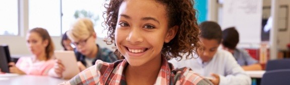 young girl at school smiling