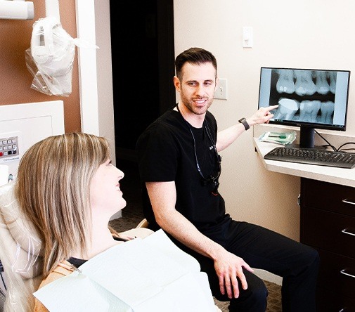 Darby Creek Dental dentist pointing to digital x-ray
