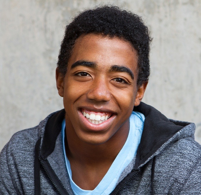teen boy smiling at camera