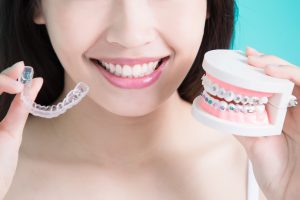 woman holding braces