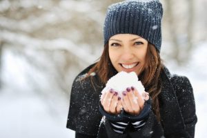 Woman smiling in the snow.