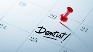 a calendar with dentist appointment reminder