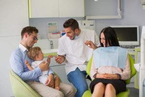 family in dental chair 
