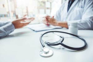 Doctor explaining health to patient