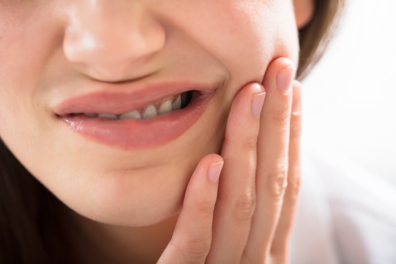 Closeup of woman experiencing toothache