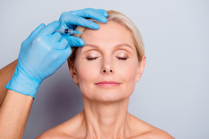 Closeup of mature woman getting BOTOX