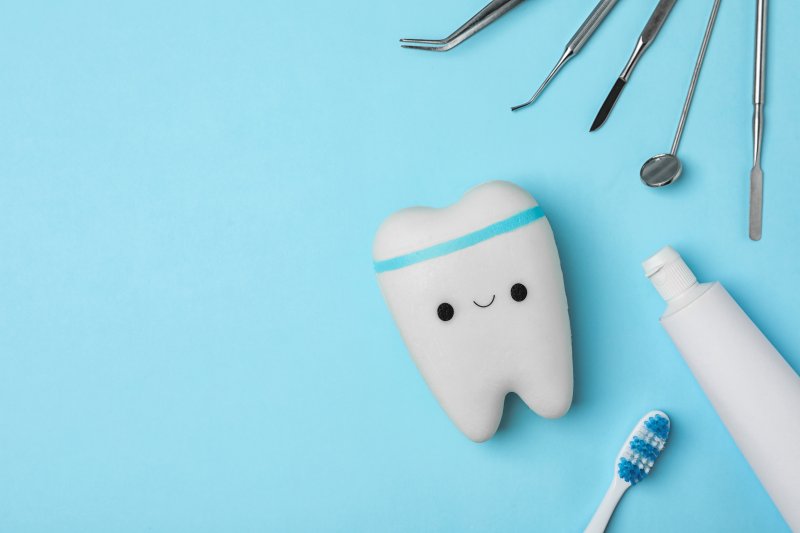 tooth surrounded by dental tools
