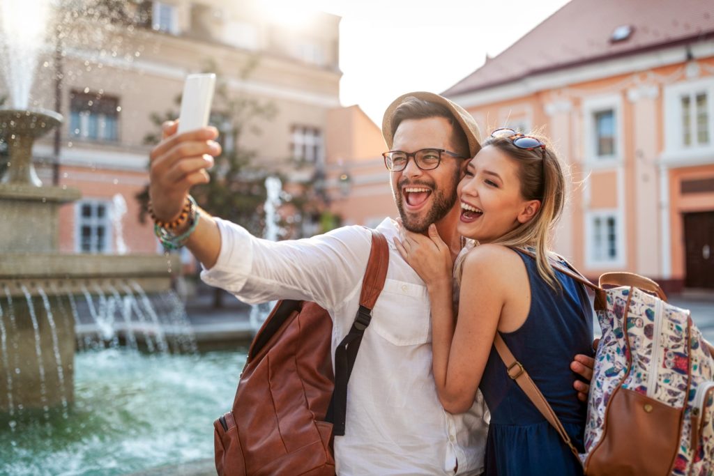 Couple smiling while enjoying summer vacation