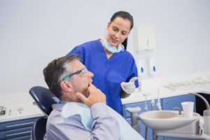 man talking to dentist 