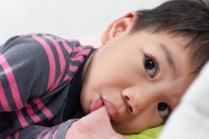 a child sucking their thumb