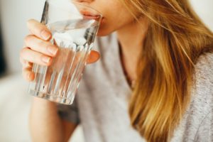 Woman taking a sip of water