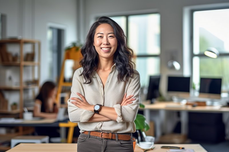 Woman smiles in office.