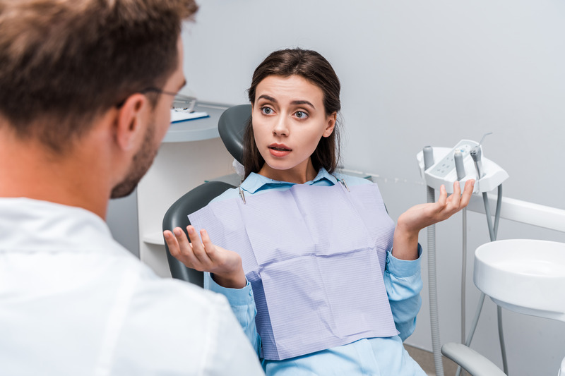 Patient talking to dentist about a root canal